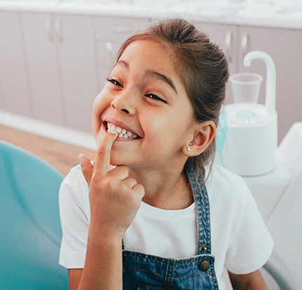 girl showing her teeth